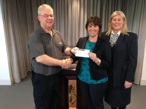 Headway Cardiff general manager, Julie Smith, accepts cheque