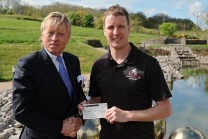 Howard Hodgson presents the cheque